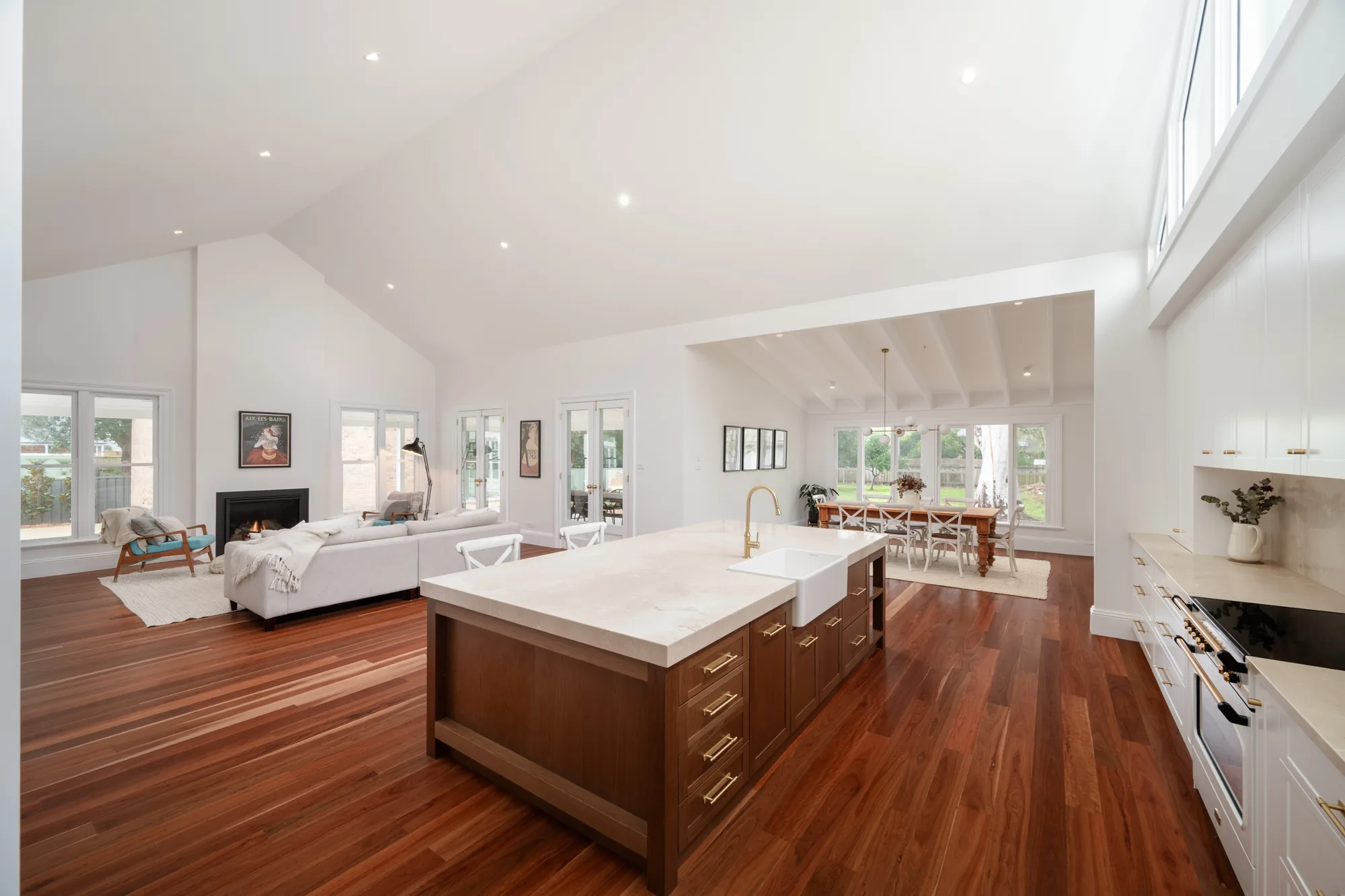 Open plan living room with large stone island kitchen at Bolwarra